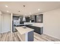 Modern kitchen with stainless steel appliances and an island at 2822 South Flat Cir, Longmont, CO 80503