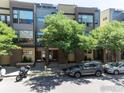 Modern townhome exterior with clean lines and neutral colors, situated in a vibrant neighborhood at 2900 Inca St # 12, Denver, CO 80202