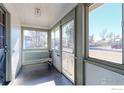 Inviting front porch with a swing and ample natural light at 304 Mckinley Ave, Fort Lupton, CO 80621