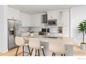 Bright kitchen featuring an island and stainless steel appliances at 3301 Arapahoe Ave # 225, Boulder, CO 80303