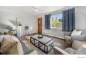 Living room with hardwood floors and modern furniture at 4455 S Logan St, Englewood, CO 80113