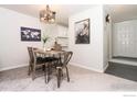 Open dining area with a wooden table and modern chairs at 4853 W Moorhead Cir, Boulder, CO 80305