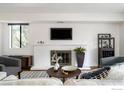 Living room with fireplace and modern decor at 600 Manhattan Dr # B6, Boulder, CO 80303