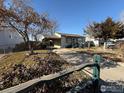 Front yard view of charming ranch home at 7901 Newport St, Commerce City, CO 80022