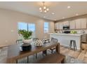 Spacious dining area with sliding glass doors to backyard at 793 Griffith St, Lochbuie, CO 80603