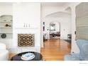 Bright living room with hardwood floors and a fireplace at 809 Pine St, Boulder, CO 80302