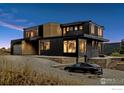 Contemporary home at dusk, showcasing architectural details at 104 Old Sunshine Trl, Boulder, CO 80302