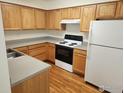 Simple kitchen with light wood cabinets and gray countertops at 1419 Red Mountain Dr # 71, Longmont, CO 80504