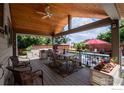 Relaxing backyard oasis with a covered patio, pool, and hot tub at 1830 Tyler Ave, Louisville, CO 80027