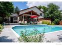 Inviting swimming pool with a large patio and seating area at 1830 Tyler Ave, Louisville, CO 80027