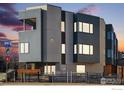 Modern three-story townhome with gray siding and wood accents at 2110 Folsom St, Boulder, CO 80302