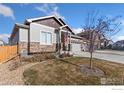 Charming two-story house with stone accents and a three-car garage at 2163 Chianina St, Mead, CO 80542