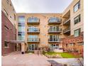 Building exterior showcasing a courtyard and balconies at 3301 Arapahoe Ave # 219, Boulder, CO 80303