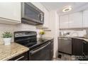 Modern kitchen with granite countertops and stainless steel appliances at 380 S Taft Ct, Louisville, CO 80027