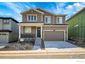 Two-story home with attached garage and landscaping at 390 Blackfoot St, Superior, CO 80027