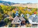 Stunning aerial view of a neighborhood with colorful autumn foliage at 3953 Springleaf Ln, Boulder, CO 80304