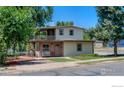 Charming two-story home with a balcony and well-maintained lawn at 4525 S Delaware St, Englewood, CO 80110