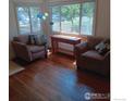 Bright living room with hardwood floors and comfy seating at 4525 S Delaware St, Englewood, CO 80110