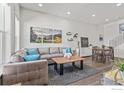 Open concept living and dining area with hardwood floors at 616 Discovery Pkwy, Superior, CO 80027