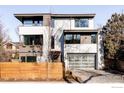 Modern two-story home with attached garage and wood fence at 635 Arapahoe Ave # A, Boulder, CO 80302