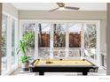 Game room with pool table and large glass doors leading to patio at 635 Arapahoe Ave # A, Boulder, CO 80302