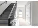 Modern staircase with metal railing and light gray steps at 635 Arapahoe Ave # A, Boulder, CO 80302