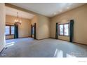 Spacious dining room with chandelier and large windows at 649 W Birch Ct, Louisville, CO 80027