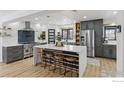 Modern kitchen with gray cabinetry, stainless steel appliances, and an island at 6969 Harvest Rd, Boulder, CO 80301