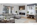 Spacious living room featuring a modern fireplace and large windows at 6969 Harvest Rd, Boulder, CO 80301