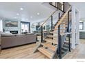 Modern light wood staircase with metal railing and open design at 6969 Harvest Rd, Boulder, CO 80301