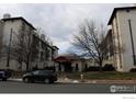 Front view of Spanish Towers building at 805, with a car parked at 805 29Th St # 157, Boulder, CO 80303