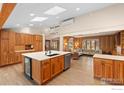 Large kitchen with island, skylights, and ample cabinet space at 819 Gapter Rd, Boulder, CO 80303