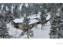 Snow covered home with large deck and mountain views at 130 Seven Hills Dr, Boulder, CO 80302