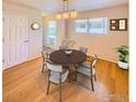 Bright dining room with hardwood floors and a round table at 1601 Great Western Dr # R1, Longmont, CO 80501