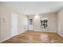 Living room with hardwood floors and neutral walls at 1740 Shallot Cir, Lafayette, CO 80026