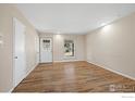 Living room with hardwood floors and neutral walls at 1740 Shallot Cir, Lafayette, CO 80026