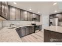 Modern kitchen with stainless steel appliances and granite countertops at 2417 Calais Dr # B, Longmont, CO 80504