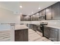 Modern kitchen with stainless steel appliances and granite countertops at 2417 Calais Dr # B, Longmont, CO 80504