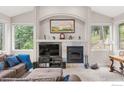 Living room features a fireplace and built-in shelving at 309 Sunrise Ln, Boulder, CO 80302