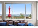 Living room boasts stunning panoramic views from large windows at 309 Sunrise Ln, Boulder, CO 80302