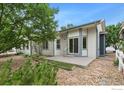 Charming backyard with gravel landscaping and patio at 3106 Depo Dr, Longmont, CO 80503