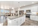 Spacious kitchen featuring granite countertops and stainless steel appliances at 543 Brennan Cir, Erie, CO 80516