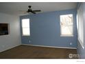 Spacious living room with neutral walls and carpet at 6297 Clayton Cir, Frederick, CO 80530