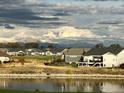 Luxury homes community with a golf course and mountain views at 8027 Tamarac Ct, Thornton, CO 80602