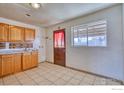 Wood cabinets, simple kitchen with back door at 940 E 89Th Ave, Thornton, CO 80229