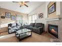 Cozy living room with fireplace and comfortable seating at 1434 Hickory Dr, Erie, CO 80516