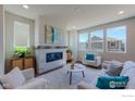 Spacious living room with fireplace and large windows at 2437 Bristol St, Superior, CO 80027