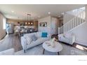 Open concept living area with kitchen, dining, and living spaces at 2437 Bristol St, Superior, CO 80027