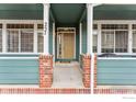 Inviting front door entry to a townhome, featuring a covered porch at 2855 Rock Creek Cir # 257, Superior, CO 80027