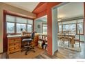 Home office and dining area with wood floors and large windows at 4135 Surrey Ct, Lafayette, CO 80026